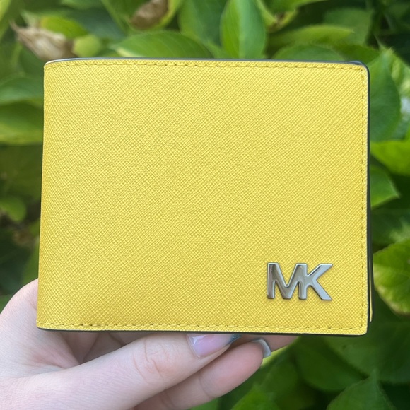 Michael Kors Handbags - Michael Kors Saffiano Leather wallet in Daisy Yellow